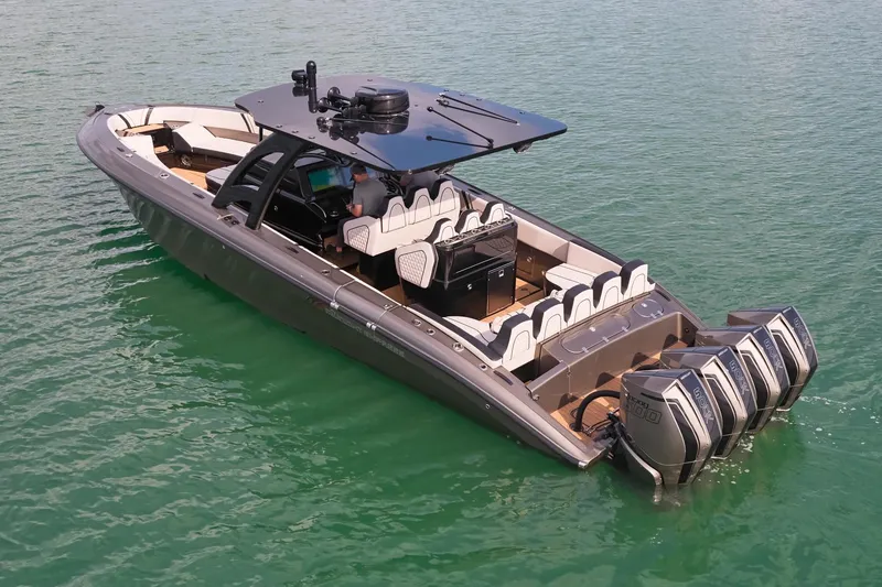 Slide: The Image of 2025 Midnight Express 37 Open boat with quad engines on calm water. - 5