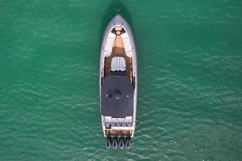 Slide: The Image of Aerial view of 2025 Midnight Express 37 Open boat on turquoise water. - 7