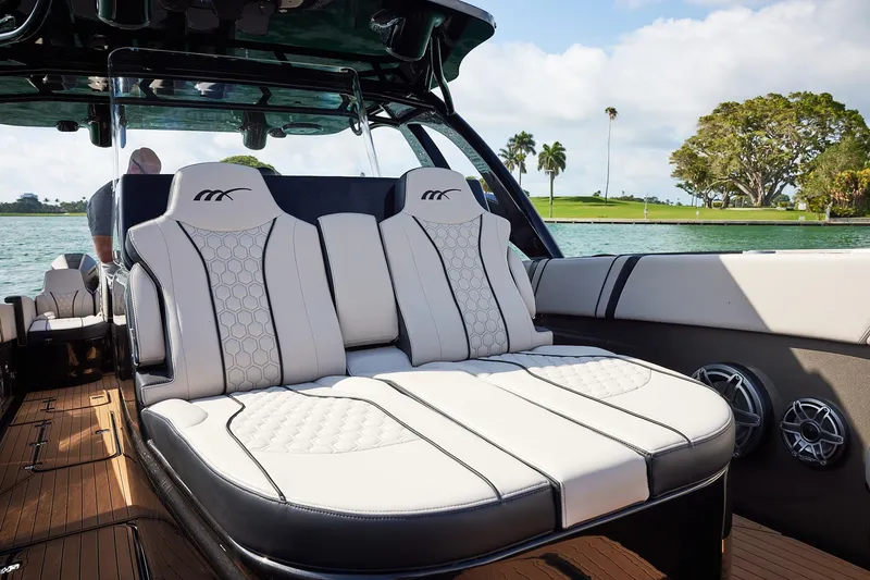 Slide: The Image of Luxurious seating on the 2025 Midnight Express 37 Open boat, featuring elegant design and waterfront view. - 9