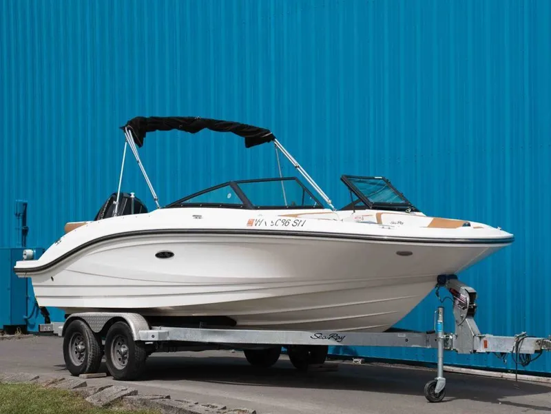 The Image of 2018 Sea Ray SPX 210 Outboard on trailer against blue background. - 1