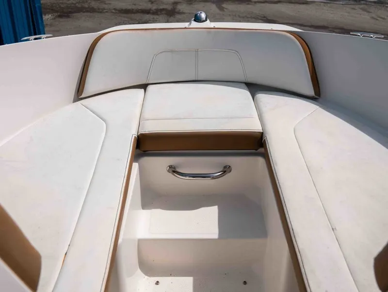 Slide: The Image of Interior of 2018 Sea Ray SPX 210 Outboard with white upholstery. - 10