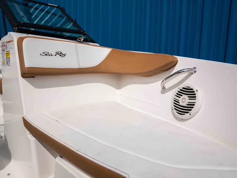 Slide: The Image of Interior of 2018 Sea Ray SPX 210 Outboard with brown upholstery. - 12