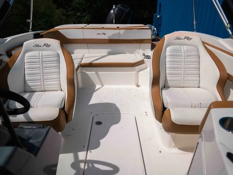 Slide: The Image of Interior of a 2018 Sea Ray SPX 210 Outboard boat with white seating. - 13