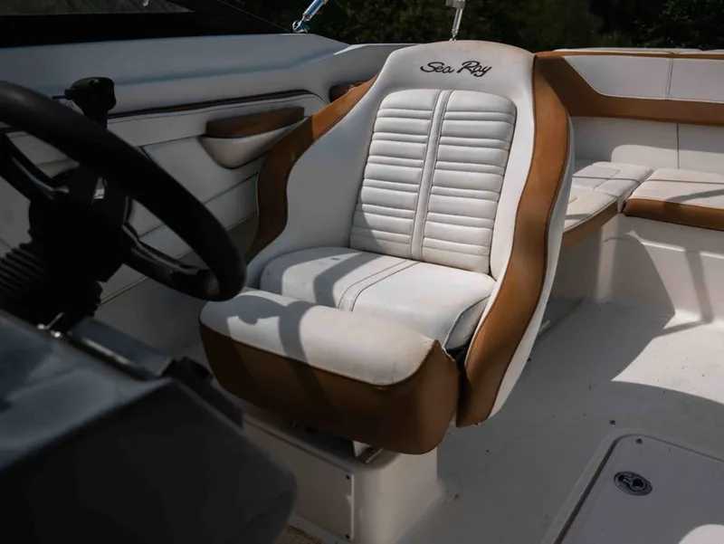 Slide: The Image of Interior of a 2018 Sea Ray SPX 210 Outboard boat with beige seating. - 14