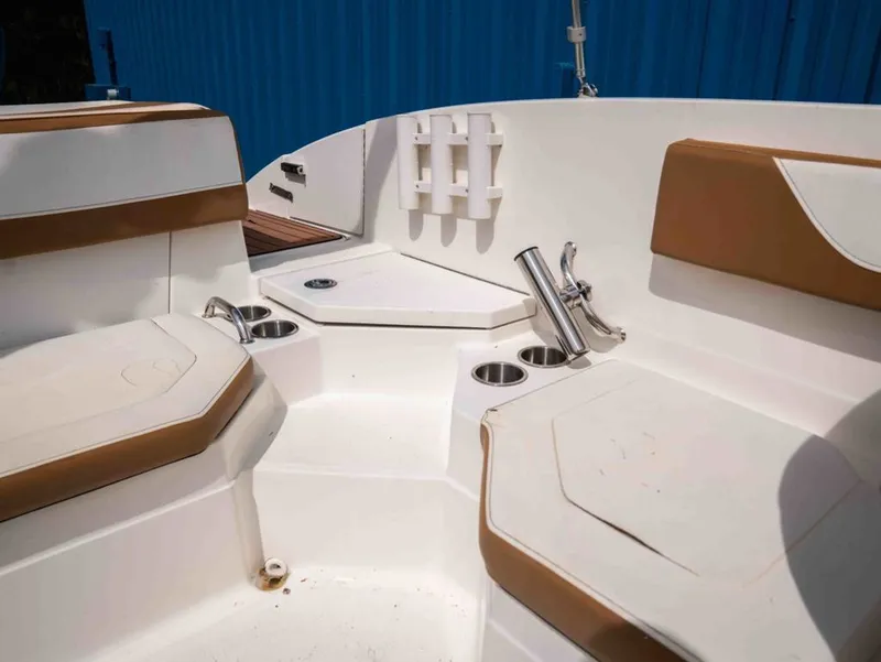 Slide: The Image of Interior of a 2018 Sea Ray SPX 210 Outboard boat with seating. - 17