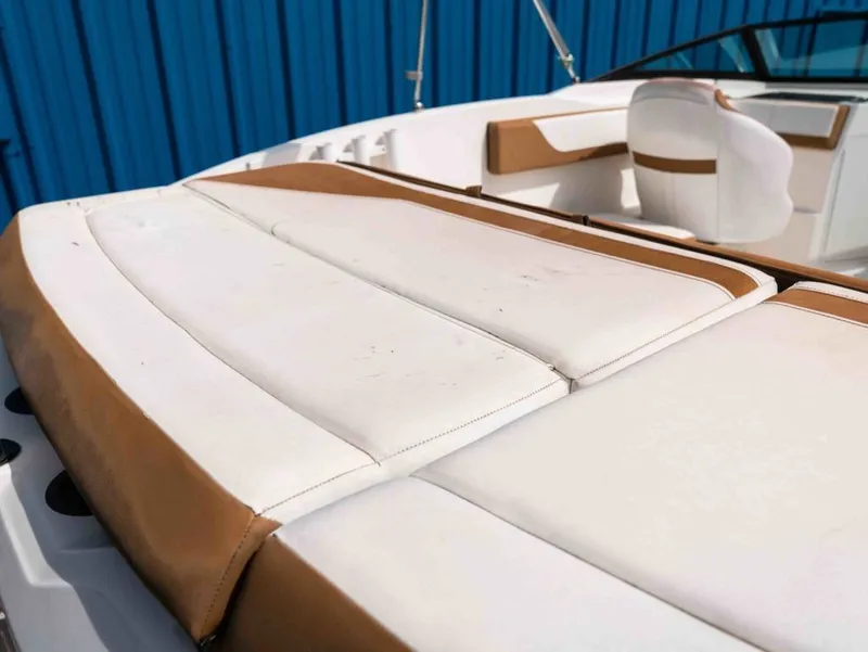 Slide: The Image of Interior of a 2018 Sea Ray SPX 210 Outboard boat with white upholstery. - 3
