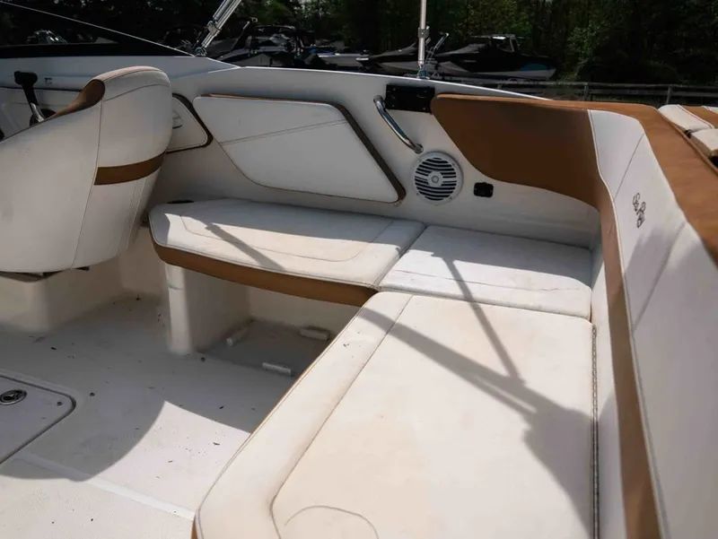 Slide: The Image of Interior of a 2018 Sea Ray SPX 210 Outboard boat with white seating. - 5