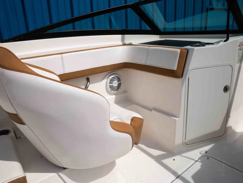Slide: The Image of Interior of 2018 Sea Ray SPX 210 Outboard with white and brown seating. - 7