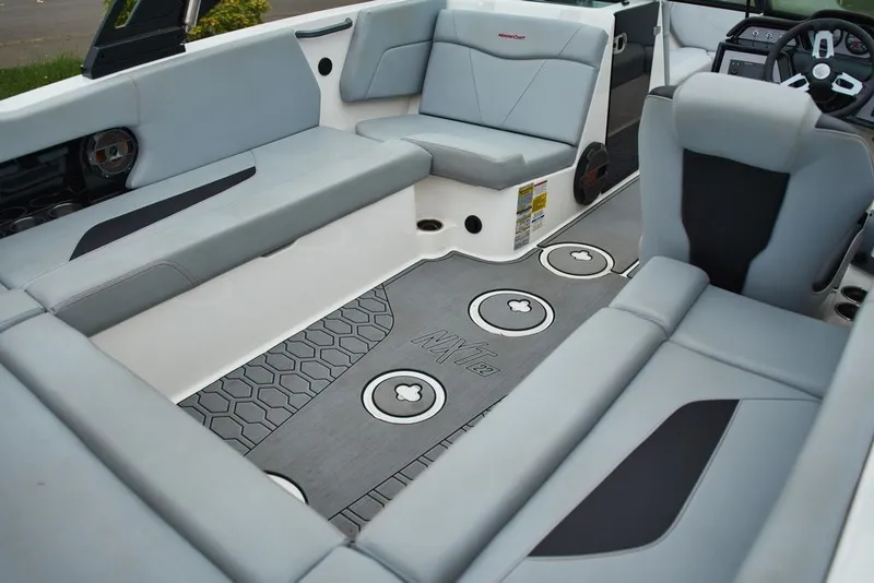 Slide: The Image of Interior of 2022 MasterCraft NXT22 with gray upholstery and modern design. - 10