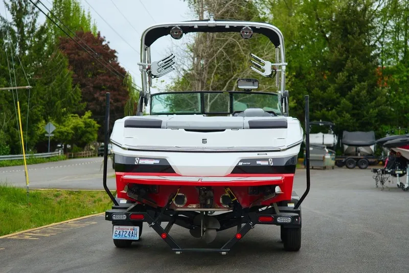 Slide: The Image of Rear view of a 2022 MasterCraft NXT22 boat on a trailer. - 3