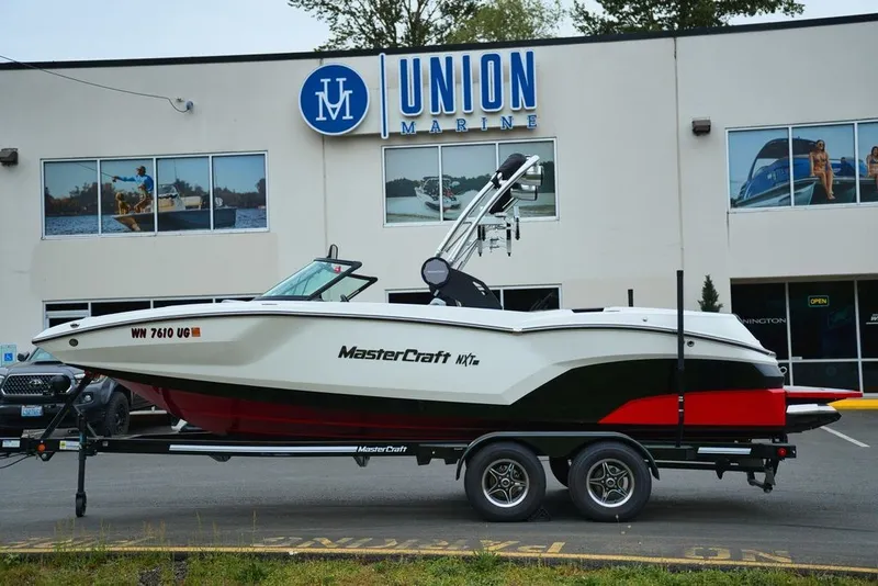 Slide: The Image of 2022 MasterCraft NXT22 boat in front of Union Marine building. - 5