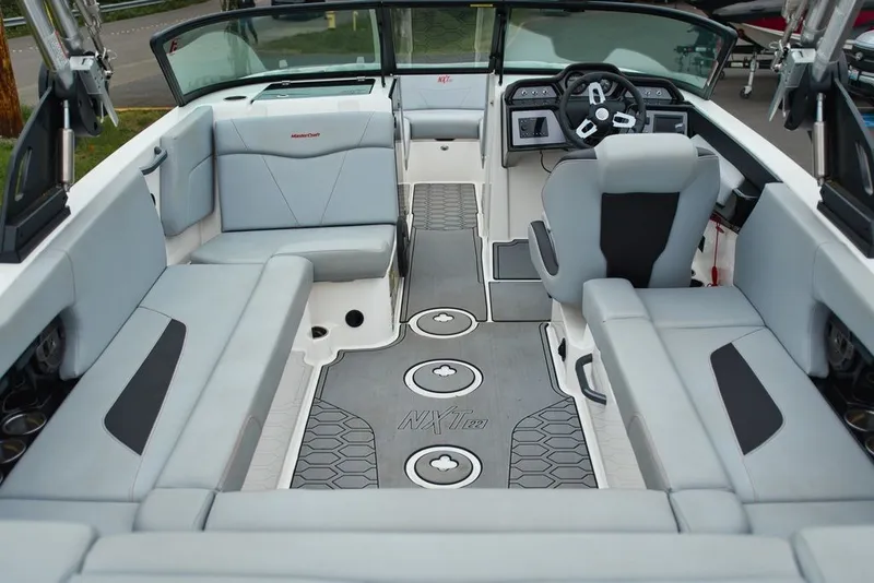 Slide: The Image of Interior of 2022 MasterCraft NXT22 with gray seating and modern design. - 8