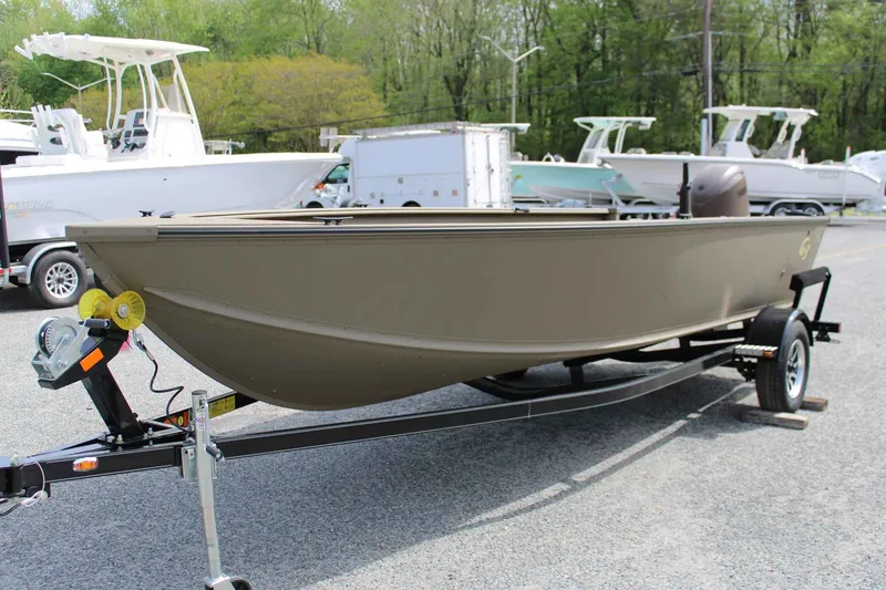 Slide: The Image of 2026 G3 Outfitter V187 T boat on trailer outdoors. - 11