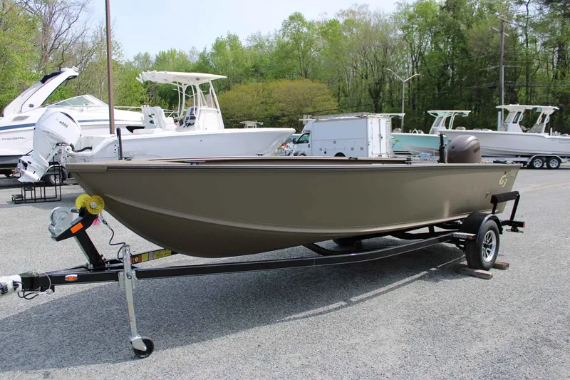 Slide: The Image of 2026 G3 Outfitter V187 T boat on trailer outdoors. - 4
