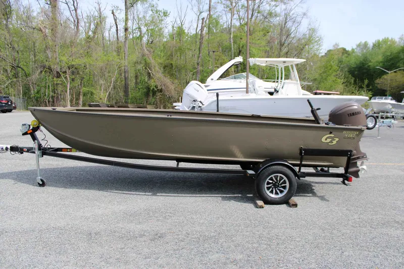 Slide: The Image of 2026 G3 Outfitter V187 T boat on trailer outdoors. - 5