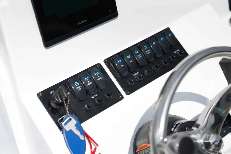 Slide: The Image of Stingray 173 CC 2026 dashboard with switches and steering wheel. - 4