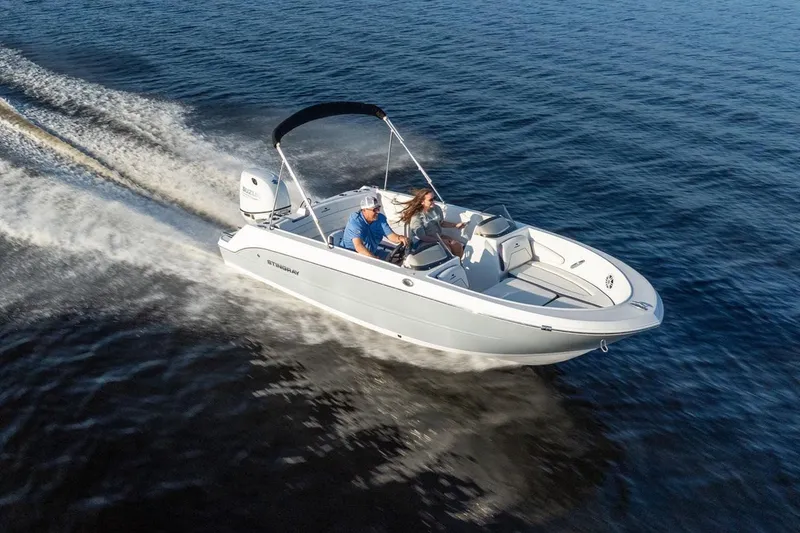 Slide: The Image of 2026 Stingray 172 DC boat cruising on open water. - 13