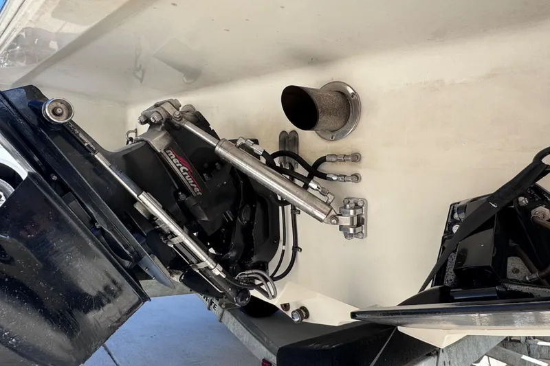Slide: The Image of Close-up of 2000 Fountain 27 Fever boat's engine components and exhaust system. - 14