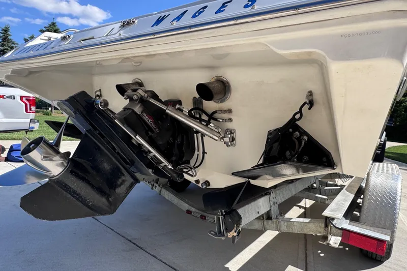 Slide: The Image of Rear view of a 2000 Fountain 27 Fever boat on a trailer, showing the propeller and drive system. - 15