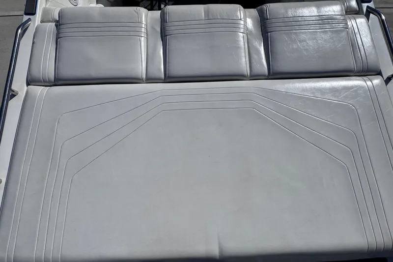 Slide: The Image of Rear seating area of a 2000 Fountain 27 Fever boat with white upholstery. - 17
