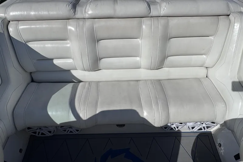 Slide: The Image of White leather seating on a 2000 Fountain 27 Fever boat, showcasing luxury and comfort. - 22