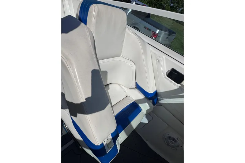 Slide: The Image of Interior of 2000 Fountain 27 Fever boat with white and blue seating. - 23