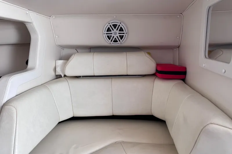 Slide: The Image of Interior of a 2000 Fountain 27 Fever boat with white seating and speaker. - 30