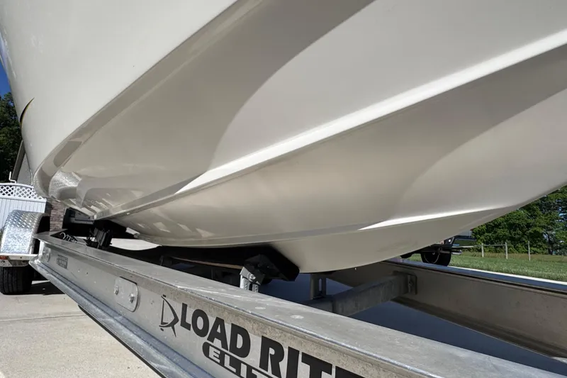 Slide: The Image of 2000 Fountain 27 Fever boat on Load Rite Elite trailer, close-up view. - 6
