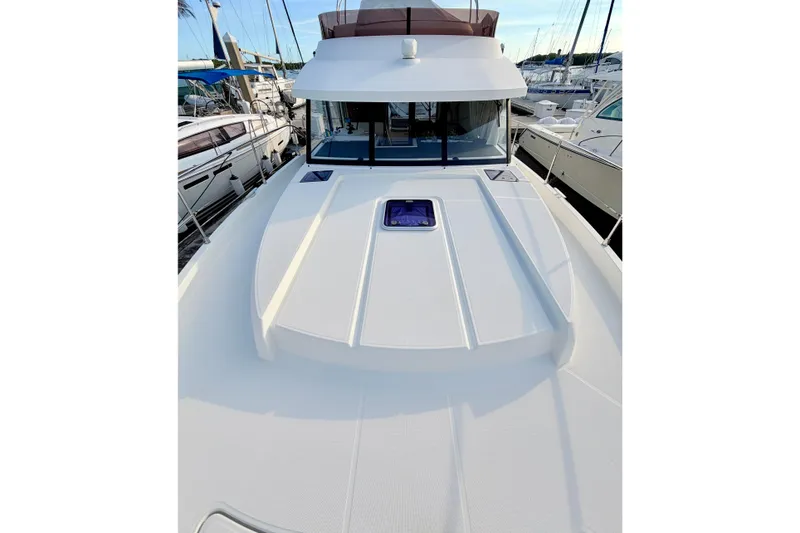 Slide: The Image of 2021 Beneteau Swift Trawler 41 Fly yacht deck view at marina. - 15
