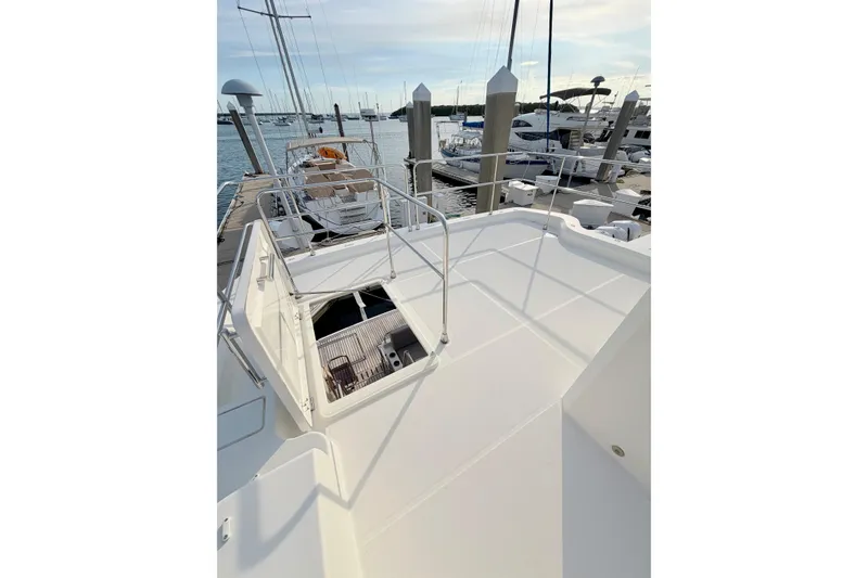 Slide: The Image of Beneteau Swift Trawler 41 Fly 2021 on deck, docked at marina with clear sky. - 16