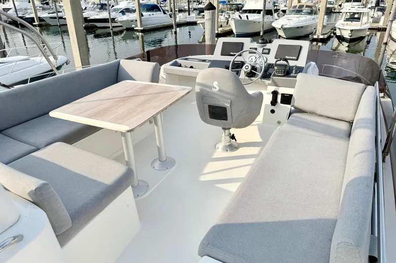 Slide: The Image of Flybridge of 2021 Beneteau Swift Trawler 41 Fly with seating and helm station. - 18
