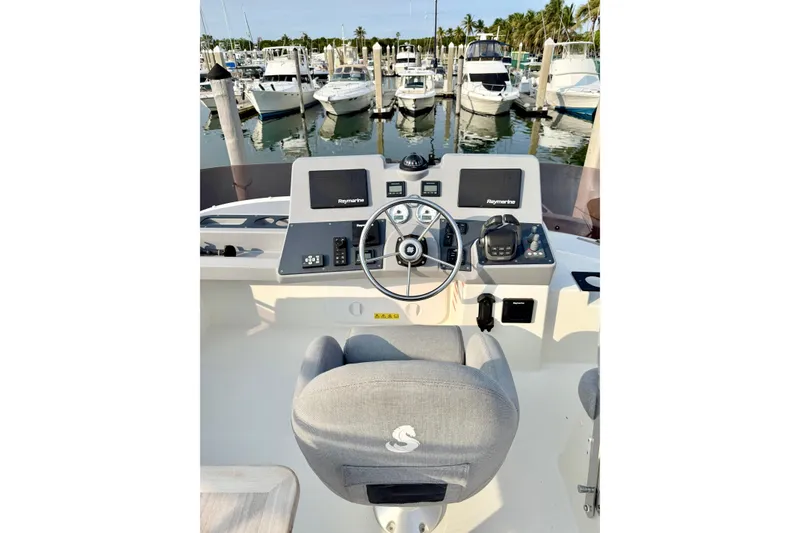 Slide: The Image of Flybridge helm of 2021 Beneteau Swift Trawler 41 Fly, featuring navigation equipment. - 20