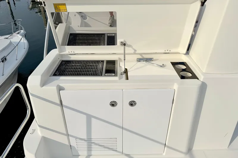 Slide: The Image of Outdoor kitchen area on a 2021 Beneteau Swift Trawler 41 Fly yacht. - 21