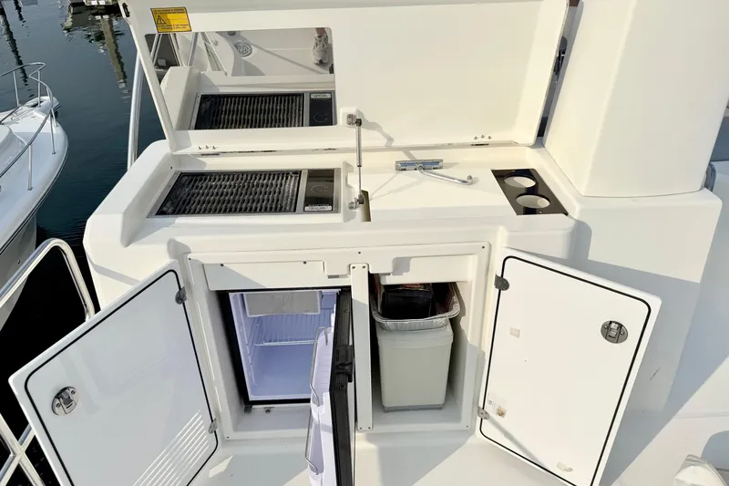 Slide: The Image of Outdoor kitchen area on a 2021 Beneteau Swift Trawler 41 Fly yacht. - 22