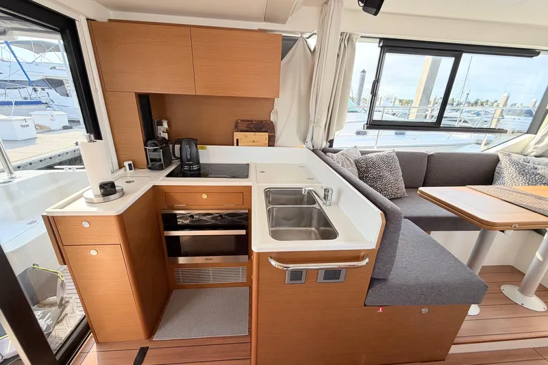 Slide: The Image of Interior of 2021 Beneteau Swift Trawler 41 Fly with modern kitchen and seating area. - 26