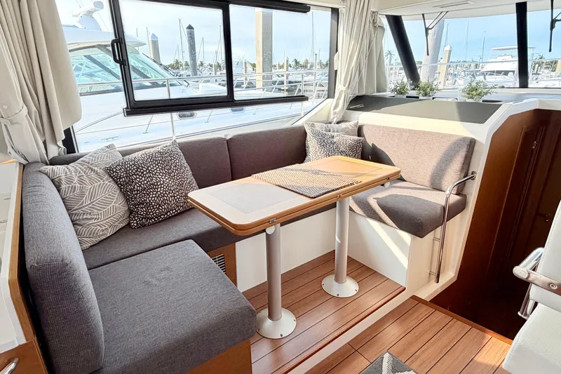 Slide: The Image of Interior of 2021 Beneteau Swift Trawler 41 Fly with cozy seating and table. - 32