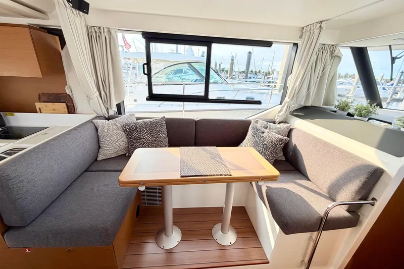 Slide: The Image of Interior of 2021 Beneteau Swift Trawler 41 Fly with cozy seating and table. - 33