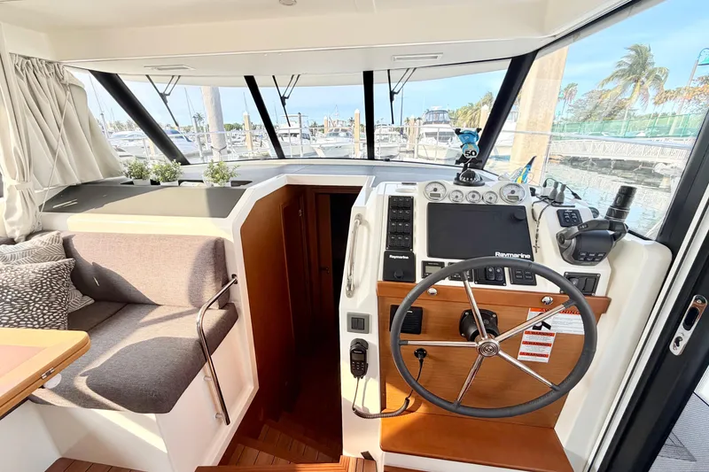 Slide: The Image of 2021 Beneteau Swift Trawler 41 Fly helm with modern navigation equipment and cozy seating. - 36