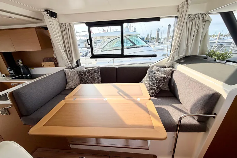 Slide: The Image of Interior of 2021 Beneteau Swift Trawler 41 Fly with cozy seating and table. - 37
