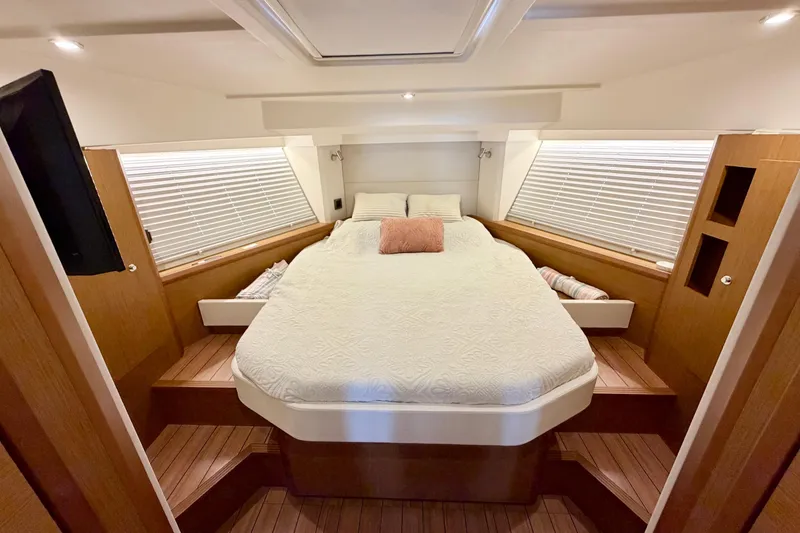 Slide: The Image of Luxurious bedroom interior of 2021 Beneteau Swift Trawler 41 Fly yacht. - 41