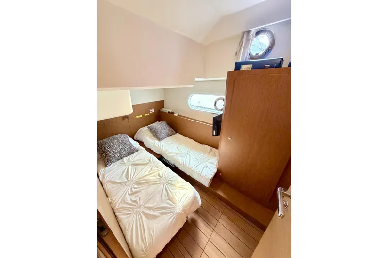 Slide: The Image of Twin cabin interior of 2021 Beneteau Swift Trawler 41 Fly with wooden finishes. - 45