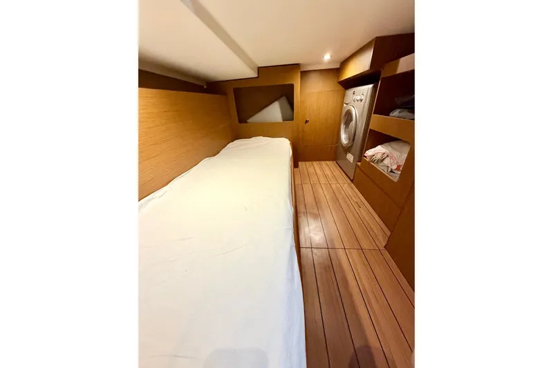 Slide: The Image of Interior cabin of 2021 Beneteau Swift Trawler 41 Fly with bed and washer. - 47