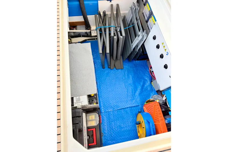 Slide: The Image of Storage compartment of 2021 Beneteau Swift Trawler 41 Fly with equipment and tools. - 49