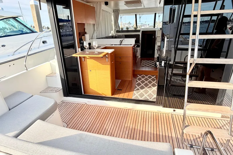 Slide: The Image of 2021 Beneteau Swift Trawler 41 Fly interior with modern kitchen and seating area. - 9