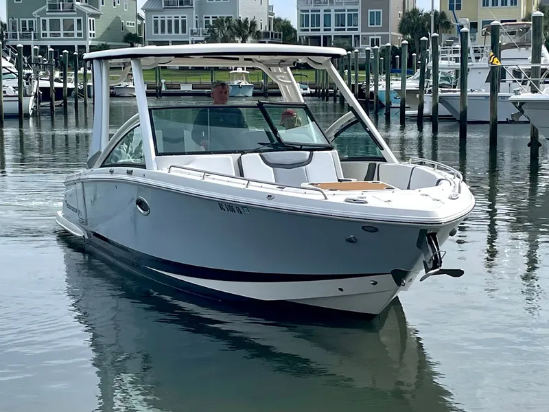 Slide: The Image of 2021 Chaparral 300 OSX boat in harbor, modern design. - 13