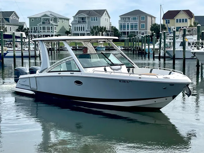 Slide: The Image of 2021 Chaparral 300 OSX boat docked in harbor. - 14