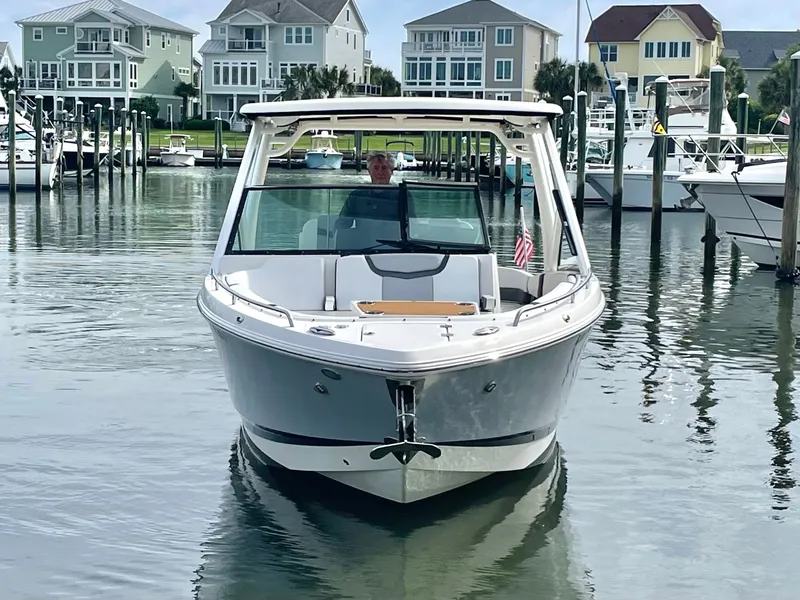 Slide: The Image of 2021 Chaparral 300 OSX boat docked in harbor. - 15
