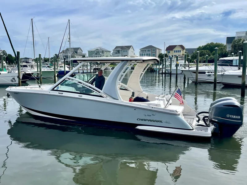 Slide: The Image of 2021 Chaparral 300 OSX boat docked with Yamaha engine. - 20