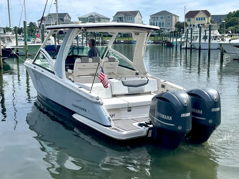 Slide: The Image of Chaparral 300 OSX 2021 boat in harbor with Yamaha engines. - 22