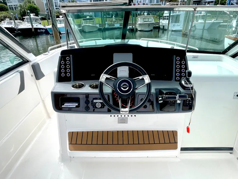 Slide: The Image of 2021 Chaparral 300 OSX helm with modern design. - 27